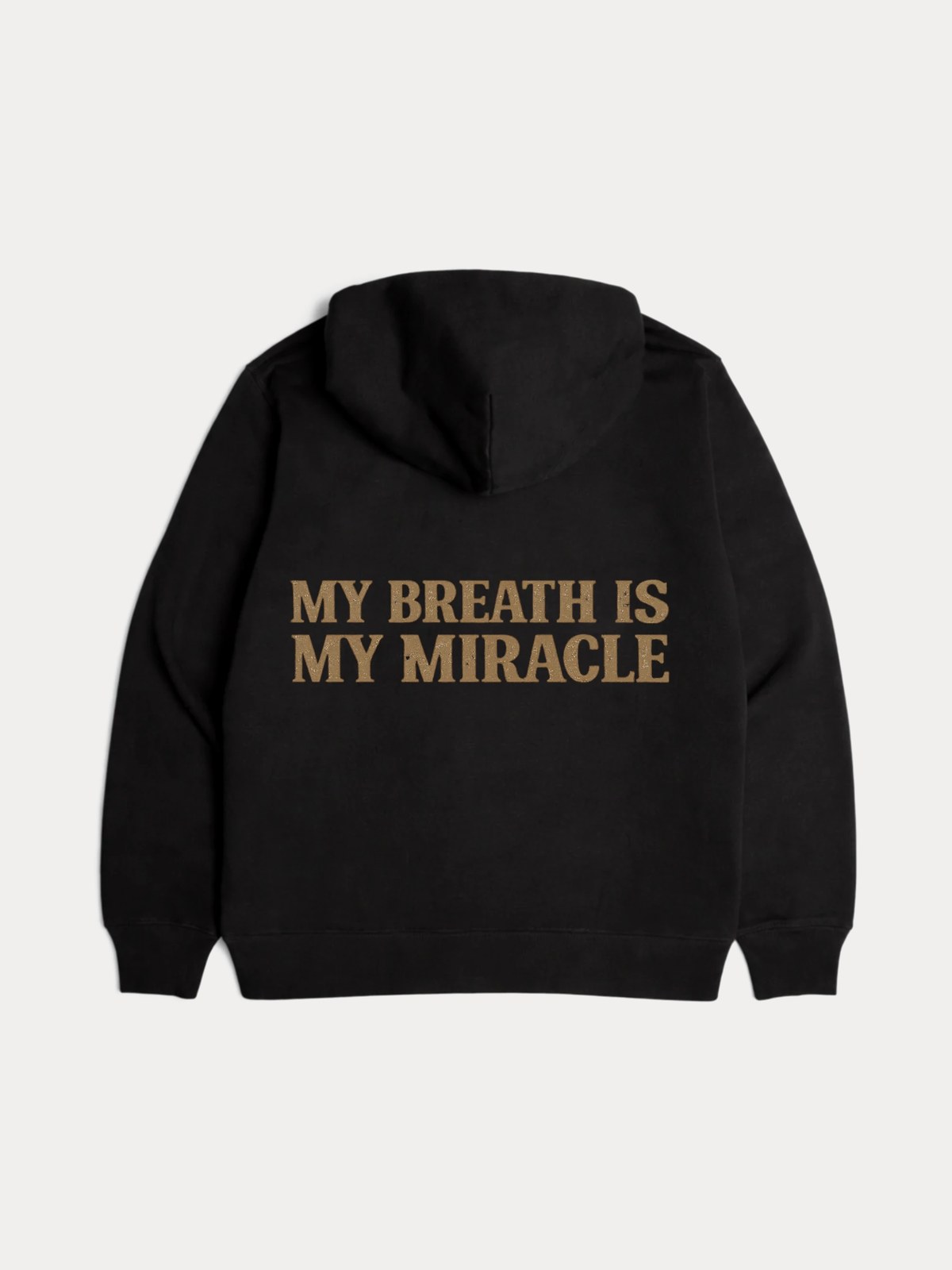 The hoodie from the back, the gold MY BREATH IS MY MIRACLE print across the shoulders