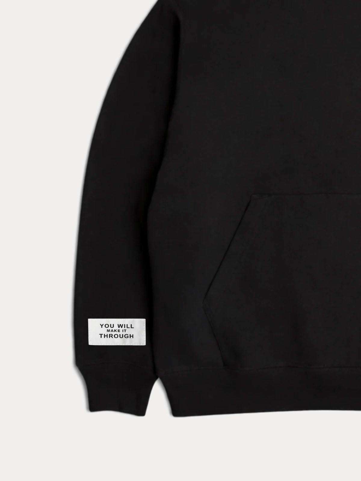 Close on the left sleeve: a woven white label reading YOU WILL MAKE IT THROUGH